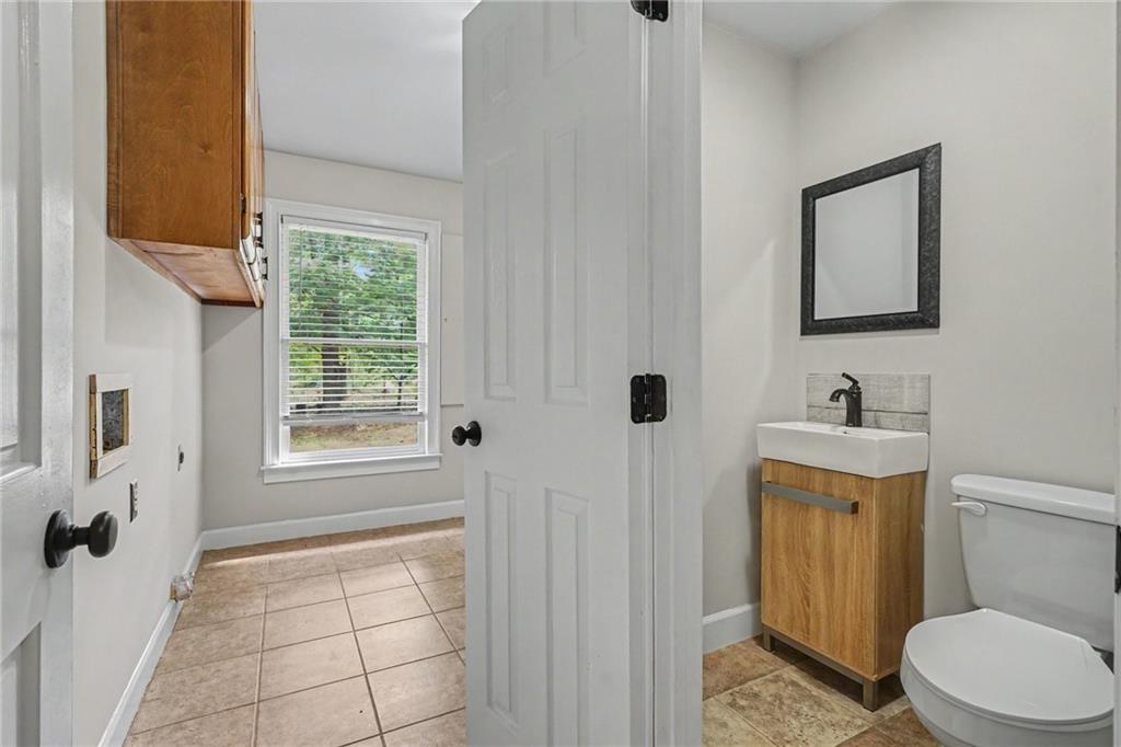 3597 Smithtown Road Suwanee, GA 30024 - Photo 7 of 24 a bathroom with a sink toilet and shower
