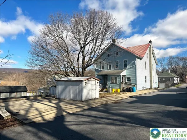 a front view of a house with a space