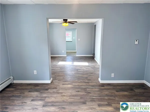 a view of a livingroom with wooden floor