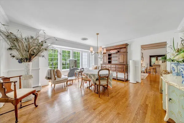 a view of a dining room with furniture and a wooden floor