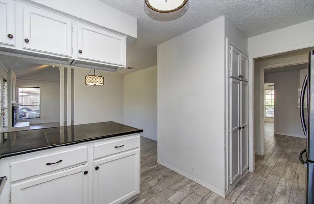 a view of a storage and utility room with closet