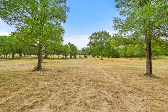 a building with trees in the background