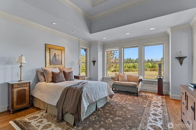 a spacious bedroom with a large bed and a couch