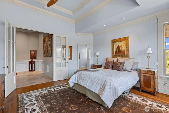 a bedroom with a bed and a view of bathroom