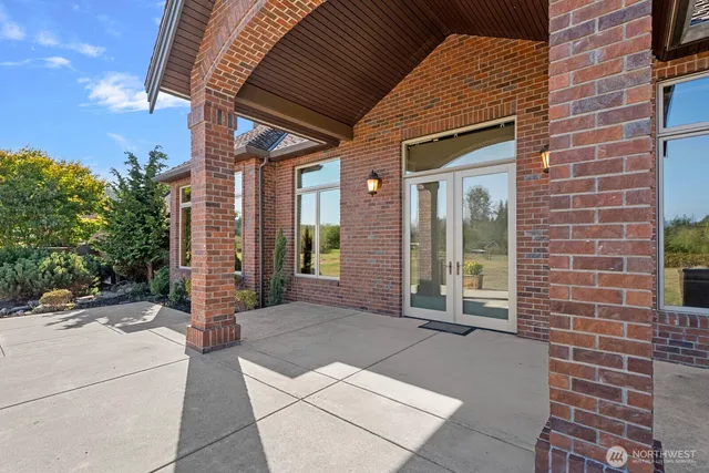 a view of a brick house with windows