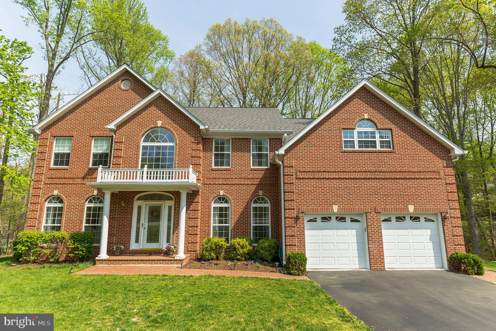 3195 Hickory Ridge Road Dunkirk, MD 20754 - Photo 1 of 41 a front view of a house with a yard and garage