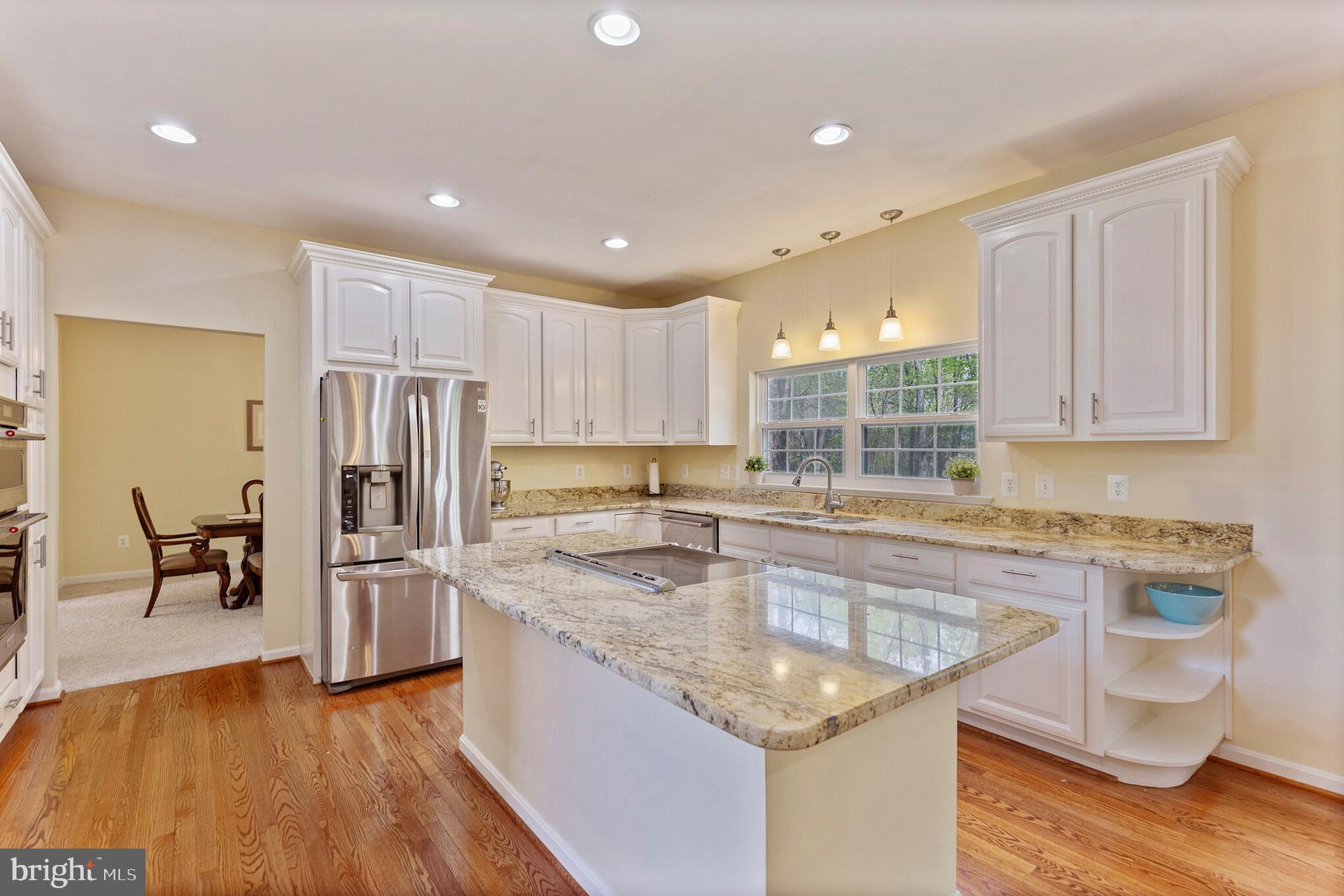 3195 Hickory Ridge Road Dunkirk, MD 20754 - Photo 2 of 41 a kitchen with stainless steel appliances granite countertop a sink stove and refrigerator