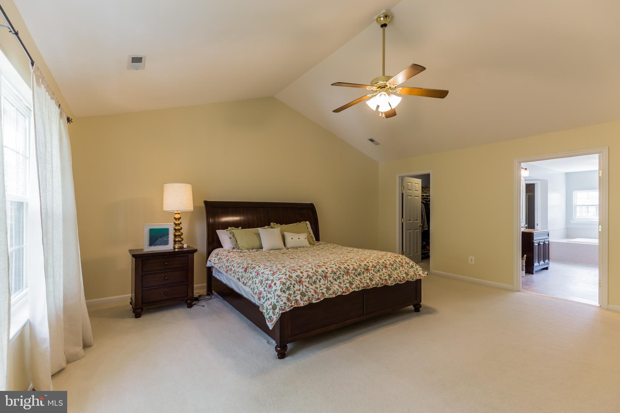 3195 Hickory Ridge Road Dunkirk, MD 20754 - Photo 15 of 41 a bedroom with a bed and a chandelier