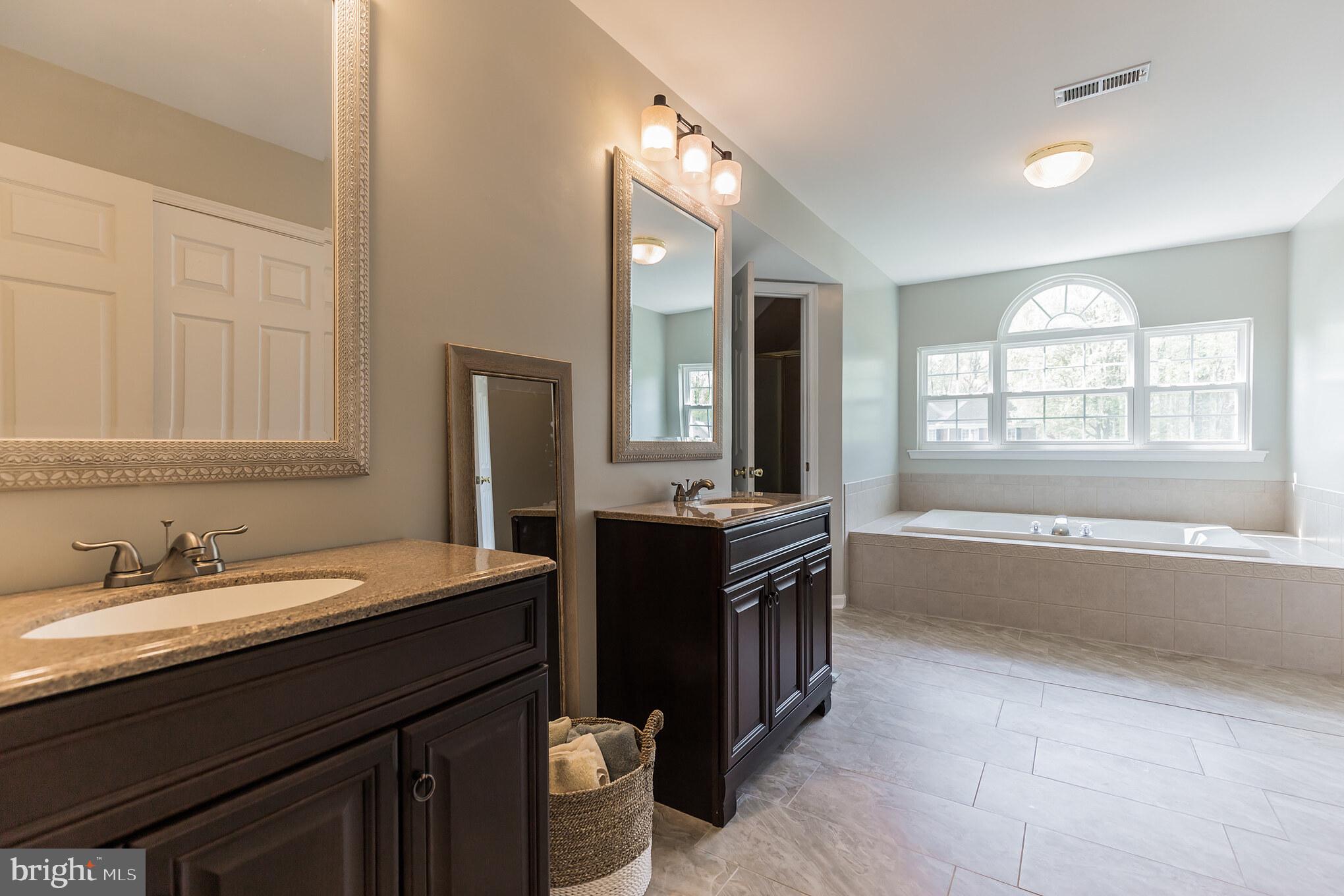 3195 Hickory Ridge Road Dunkirk, MD 20754 - Photo 16 of 41 a spacious bathroom with a bathtub and a sink