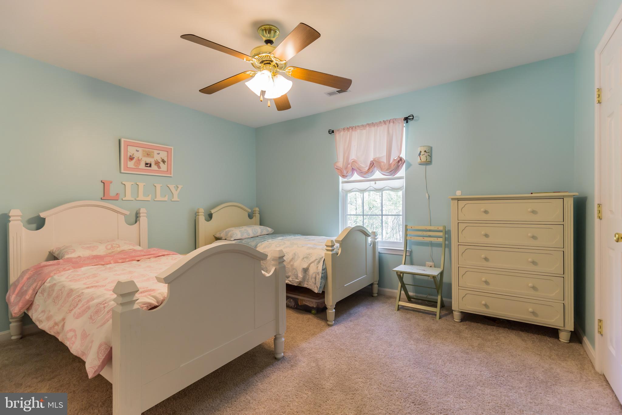 3195 Hickory Ridge Road Dunkirk, MD 20754 - Photo 20 of 41 a bedroom with a bed and a chandelier