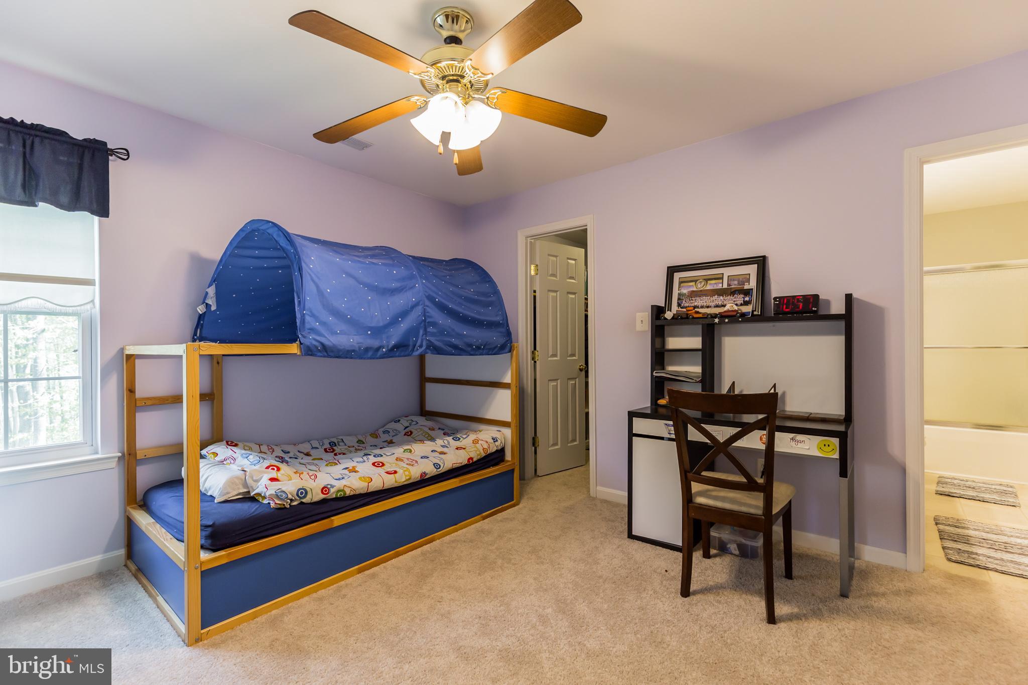 3195 Hickory Ridge Road Dunkirk, MD 20754 - Photo 22 of 41 a bedroom with a bed and a chandelier