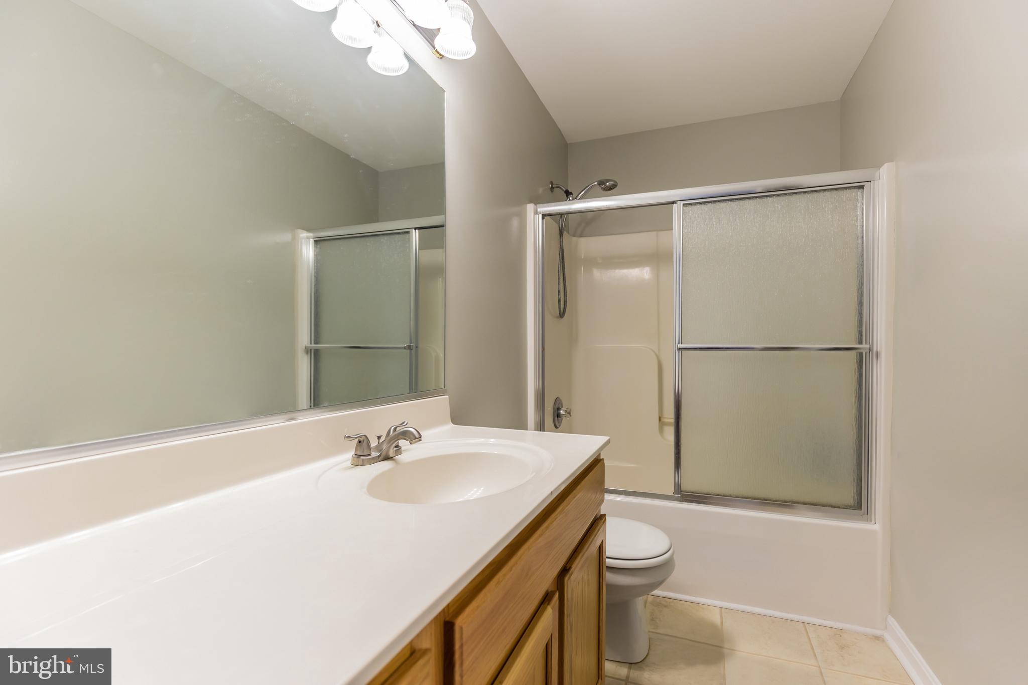 3195 Hickory Ridge Road Dunkirk, MD 20754 - Photo 23 of 41 a bathroom with a sink a toilet and shower