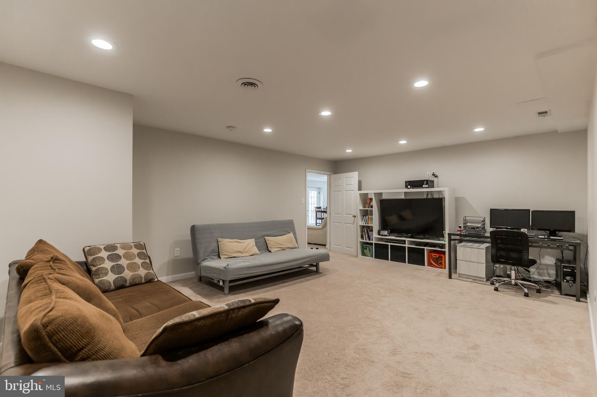 3195 Hickory Ridge Road Dunkirk, MD 20754 - Photo 26 of 41 a living room with furniture and a flat screen tv