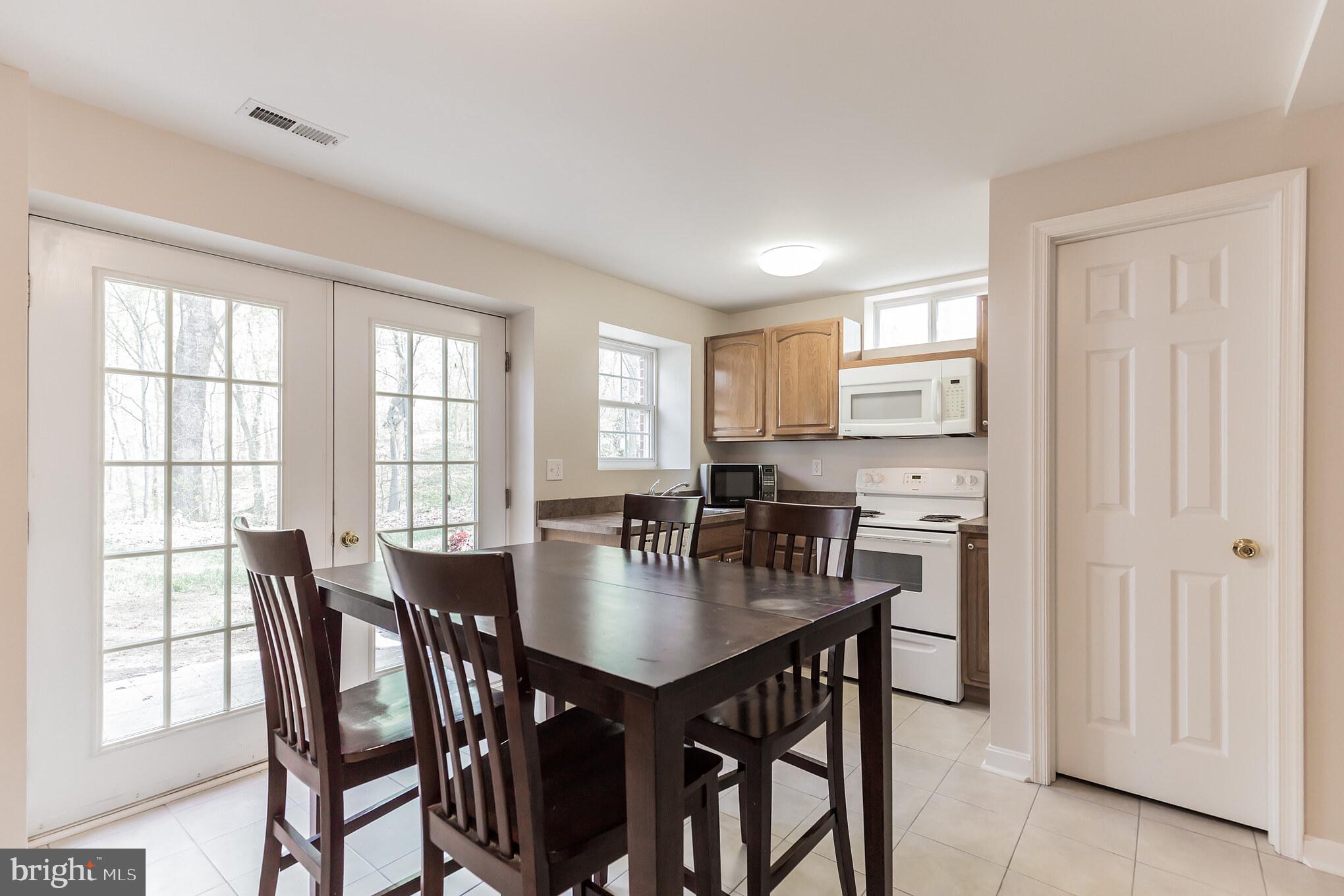 3195 Hickory Ridge Road Dunkirk, MD 20754 - Photo 28 of 41 a view of a dining room with furniture and a window