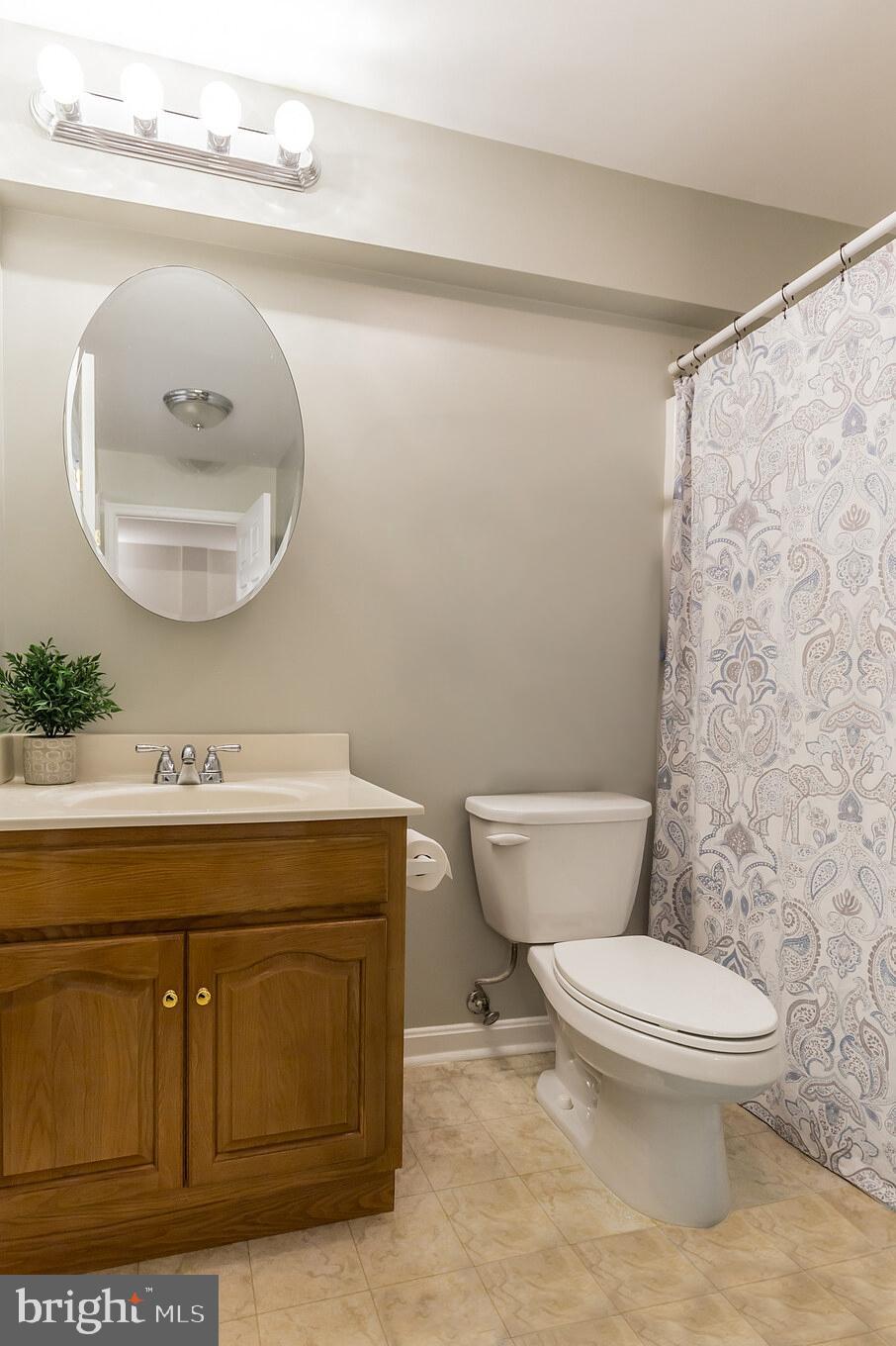3195 Hickory Ridge Road Dunkirk, MD 20754 - Photo 30 of 41 a bathroom with a granite countertop toilet sink and mirror