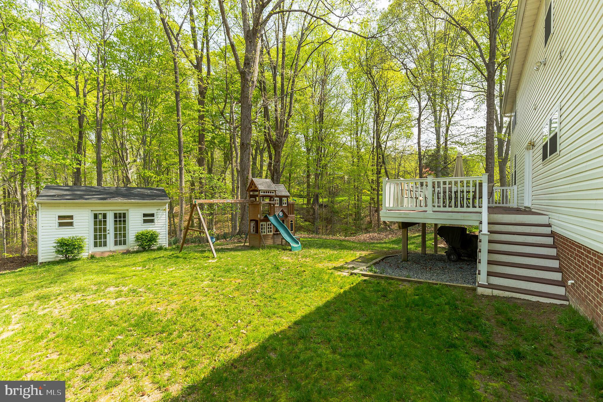 3195 Hickory Ridge Road Dunkirk, MD 20754 - Photo 31 of 41 a view of a house with a backyard and a patio