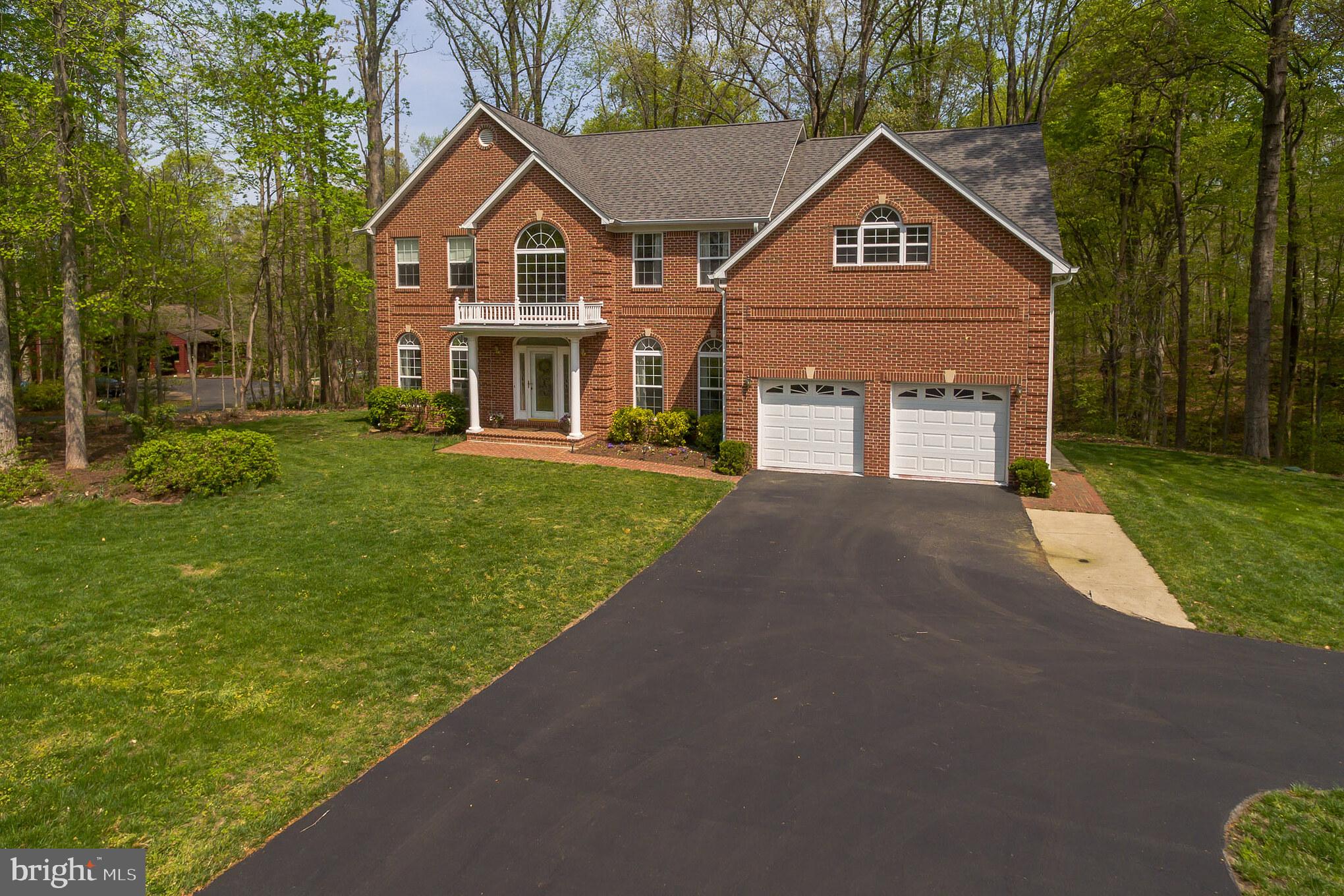 3195 Hickory Ridge Road Dunkirk, MD 20754 - Photo 38 of 41 a front view of a house with a yard and garage