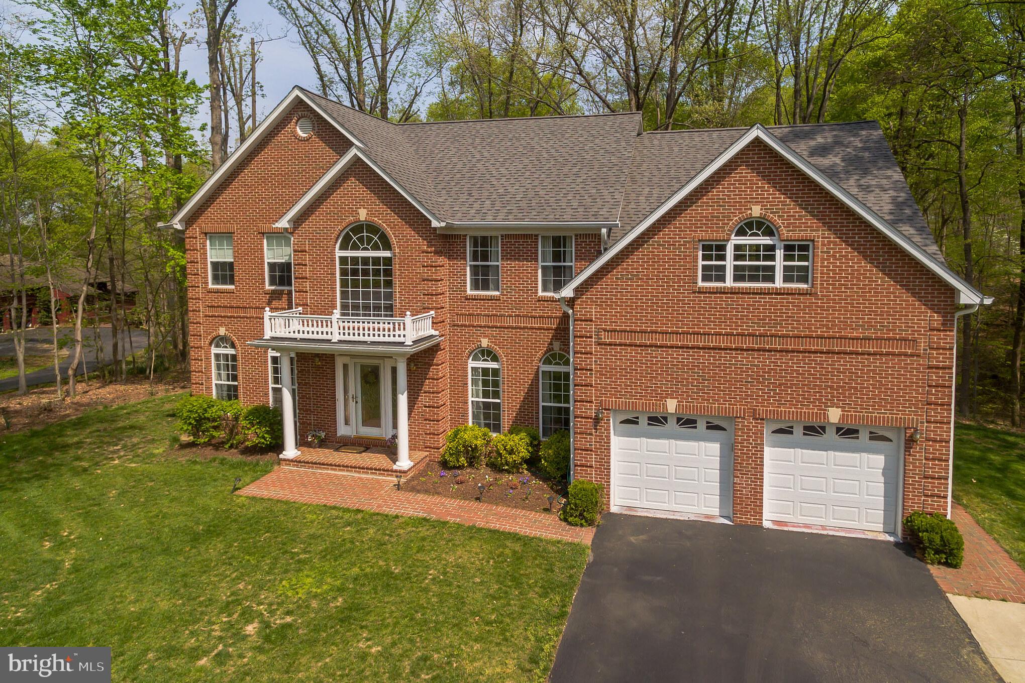 3195 Hickory Ridge Road Dunkirk, MD 20754 - Photo 39 of 41 a front view of a house with a yard and garage