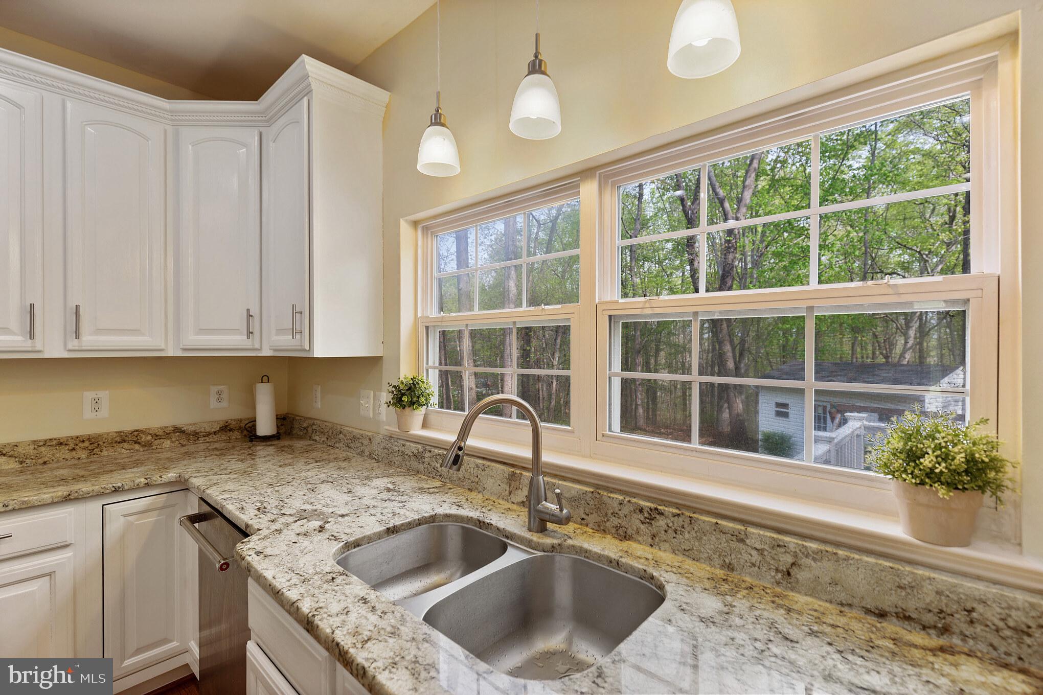 3195 Hickory Ridge Road Dunkirk, MD 20754 - Photo 6 of 41 a kitchen with granite countertop a sink and a window