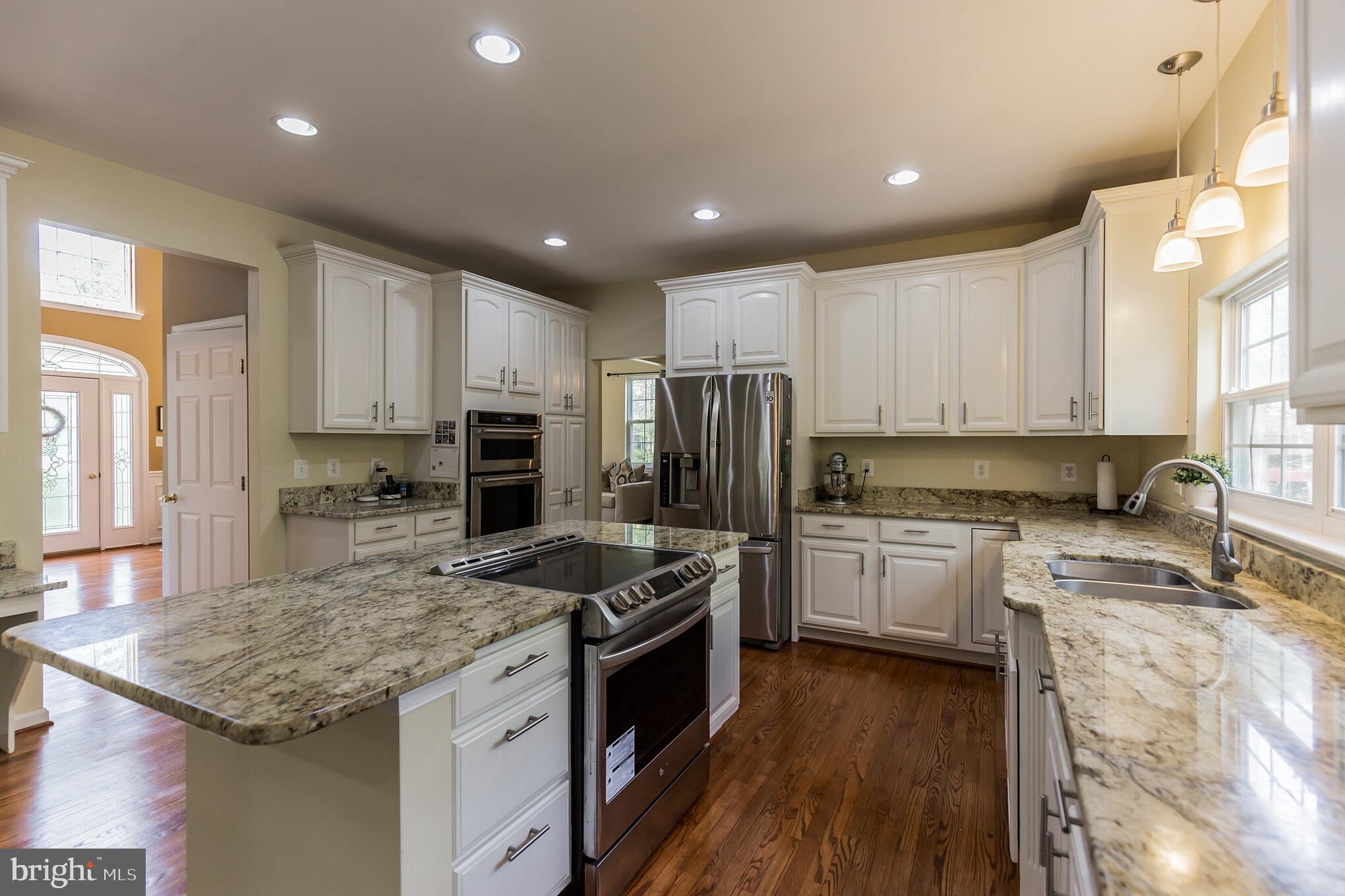 3195 Hickory Ridge Road Dunkirk, MD 20754 - Photo 7 of 41 a kitchen with a stove sink and refrigerator