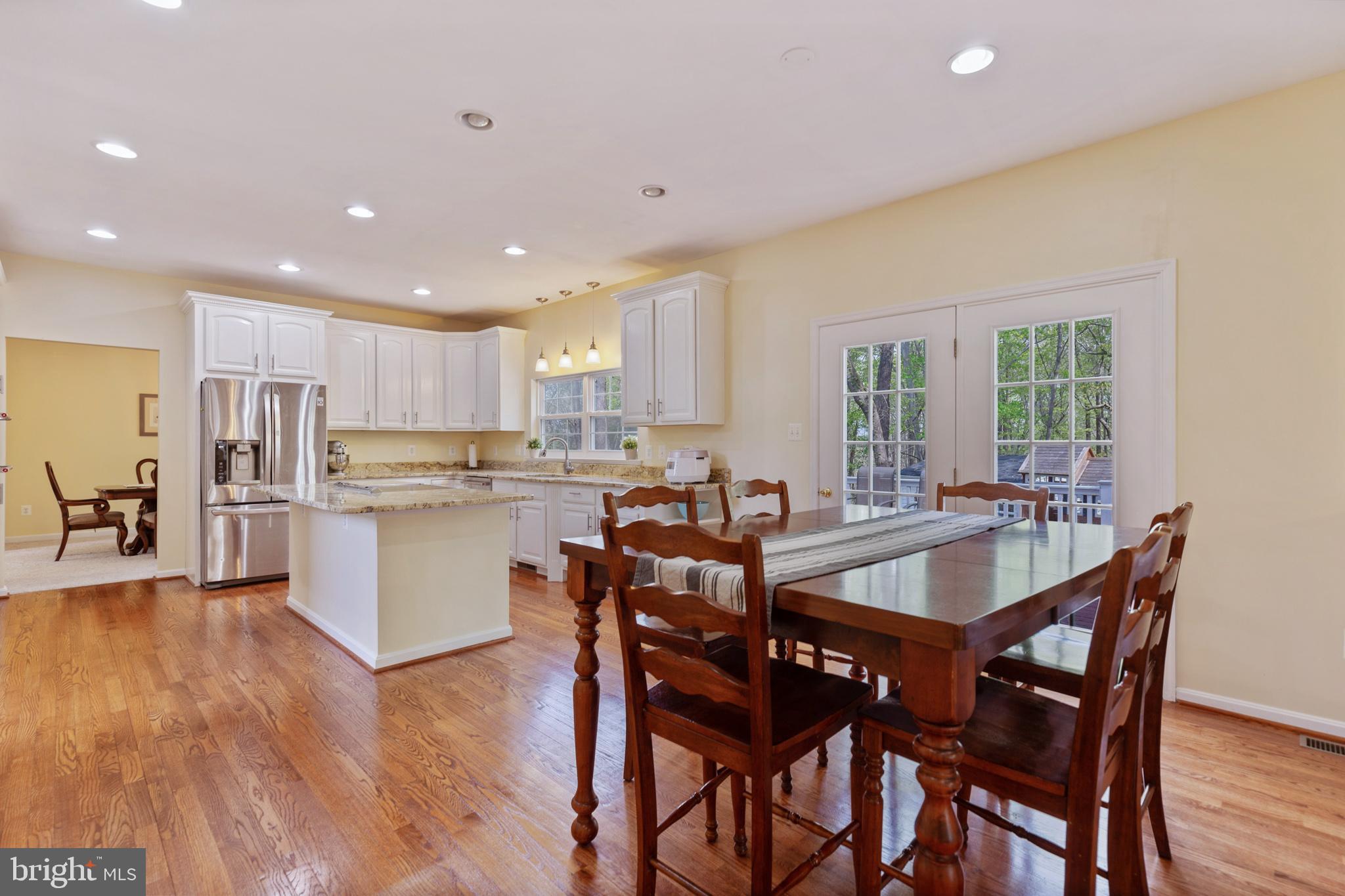 3195 Hickory Ridge Road Dunkirk, MD 20754 - Photo 8 of 41 a view of a dining room with furniture and wooden floor
