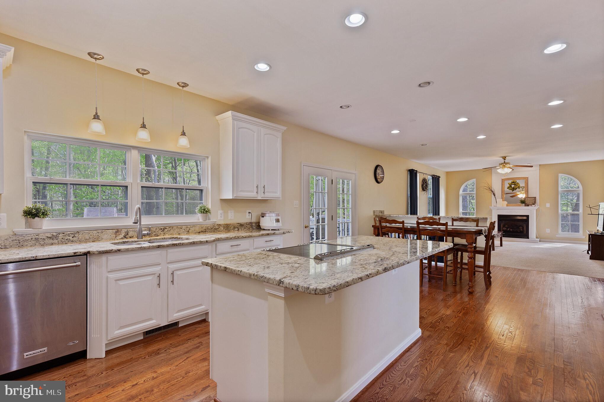 3195 Hickory Ridge Road Dunkirk, MD 20754 - Photo 9 of 41 a large kitchen with kitchen island a sink table and chairs