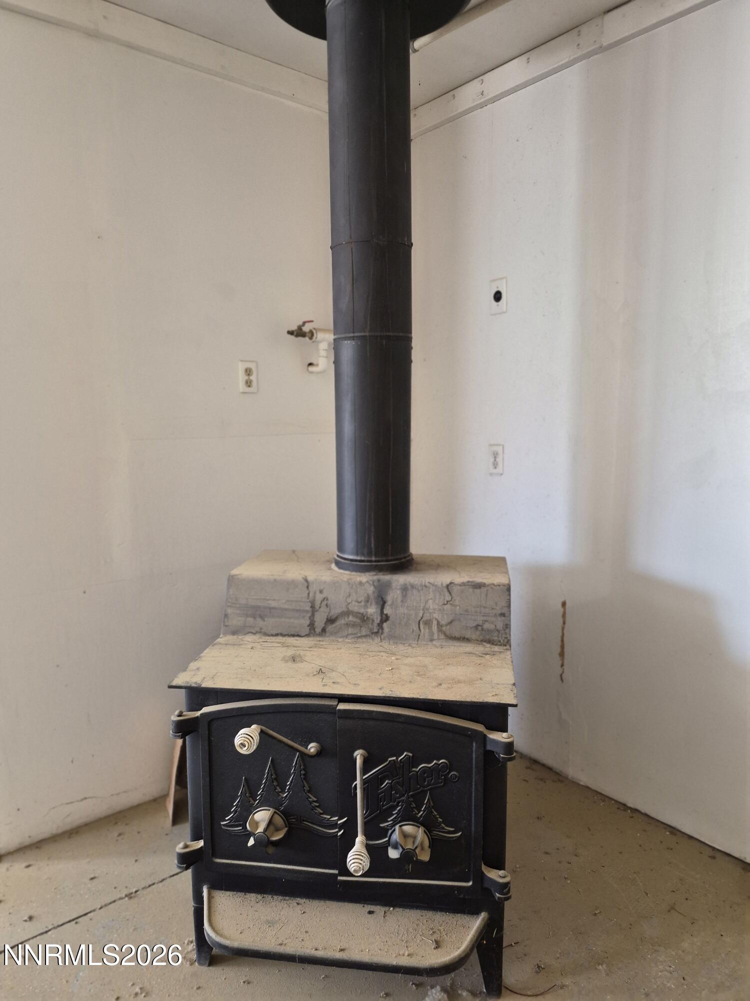 1140 Pine Road Fallon, NV 89406 - Photo 22 of 23 PINE GARAGE WOOD BURNING