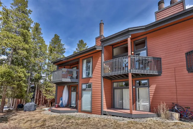 a view of a house with a tree