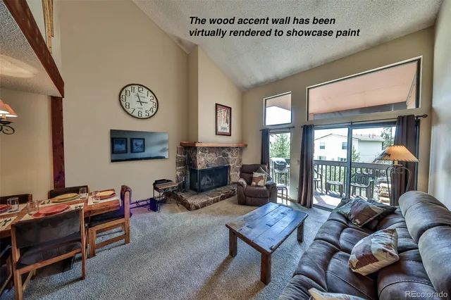a living room with furniture ceiling fan and a window