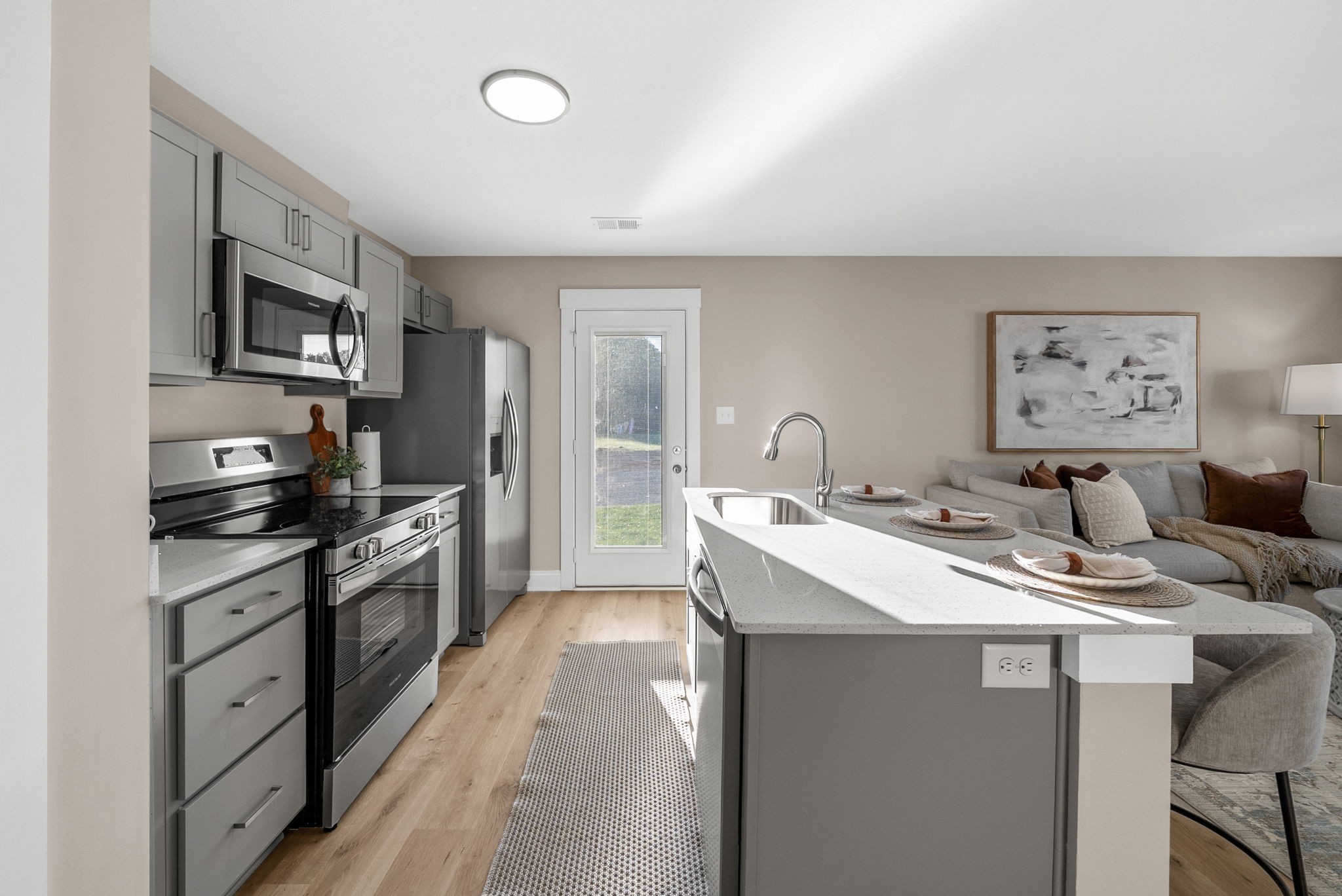 225 Primrose Way Oak Grove, KY 42262 - Photo 6 of 20 a kitchen with stainless steel appliances kitchen island granite countertop a sink stove and refrigerator