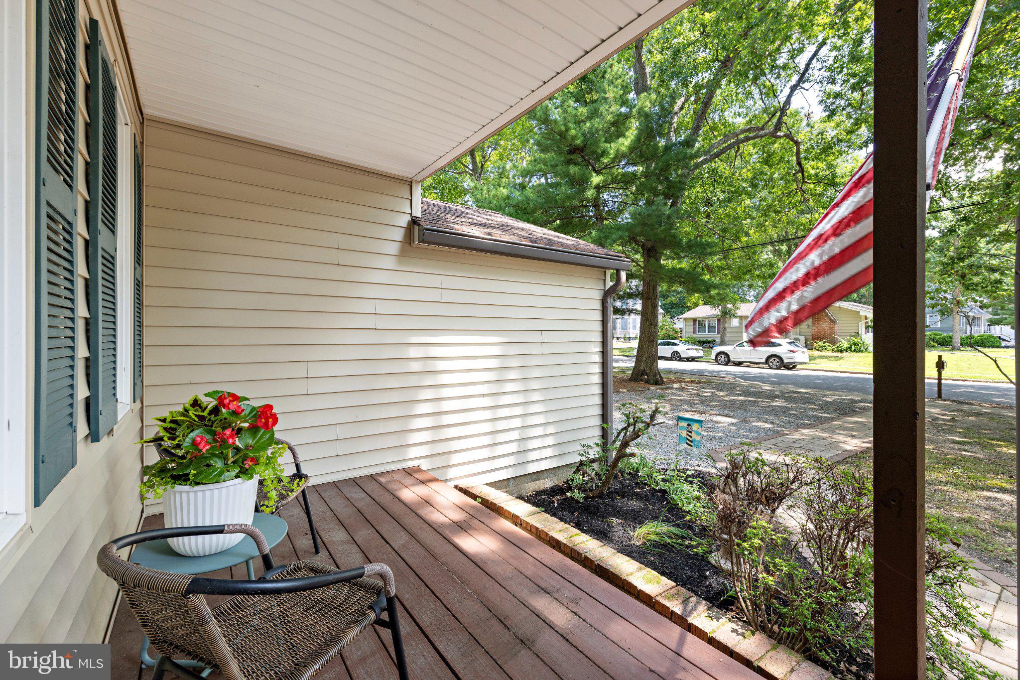 166 Rutgers Avenue Manahawkin, NJ 08050 - Photo 6 of 30 Charming porch with lush greenery.