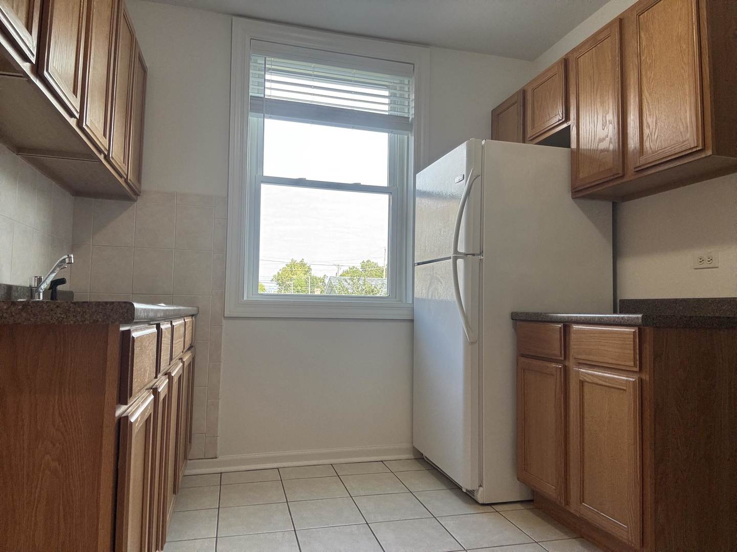 2524 West Ardmore Avenue, Unit 1 Chicago, IL 60659 - Photo 13 of 21 a view of a storage and utility room with a window