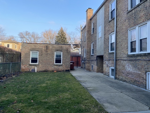 2524 West Ardmore Avenue, Unit 1 Chicago, IL 60659 - Photo 21 of 21 a view of a house with a yard and sitting area