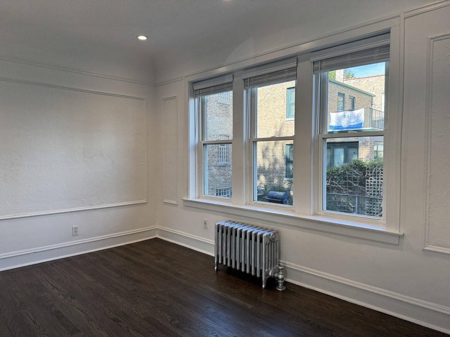 2524 West Ardmore Avenue, Unit 1 Chicago, IL 60659 - Photo 8 of 21 a view of empty room with wooden floor and fan