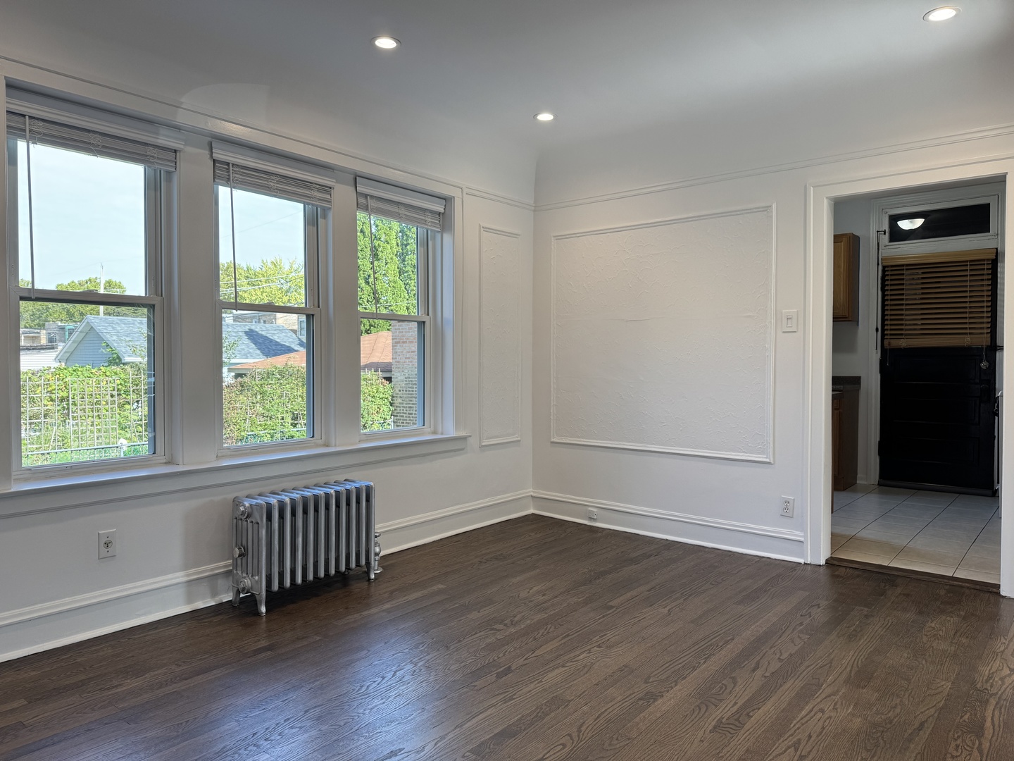 2524 West Ardmore Avenue, Unit 1 Chicago, IL 60659 - Photo 10 of 21 an empty room with wooden floor and windows