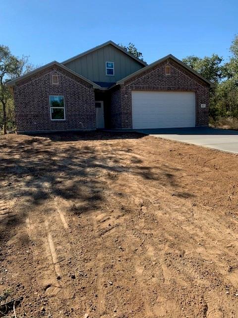 411 Hamilton Road Mineral Wells, TX 76067 - Photo 2 of 12 a front view of a house with a yard