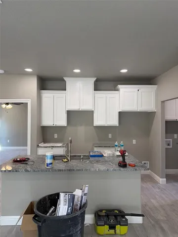 a kitchen with counter top space and appliances