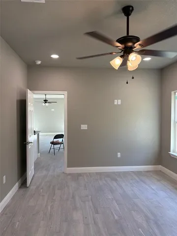 a kitchen with granite countertop a sink a stove and cabinets