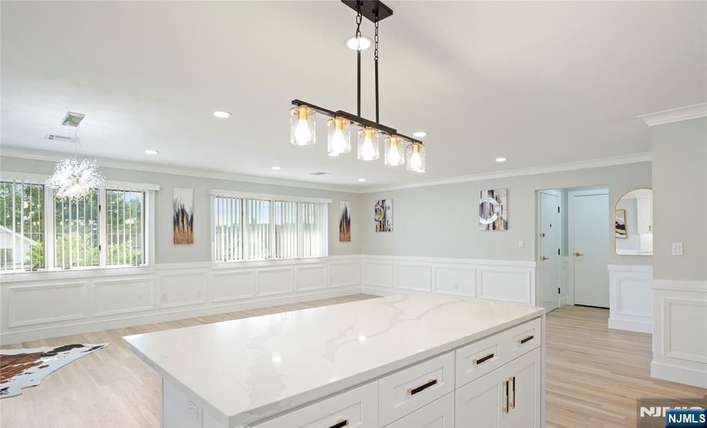 243 Hayward Place Wallington, NJ 07057 - Photo 3 of 9 a living room with a large window and chandelier