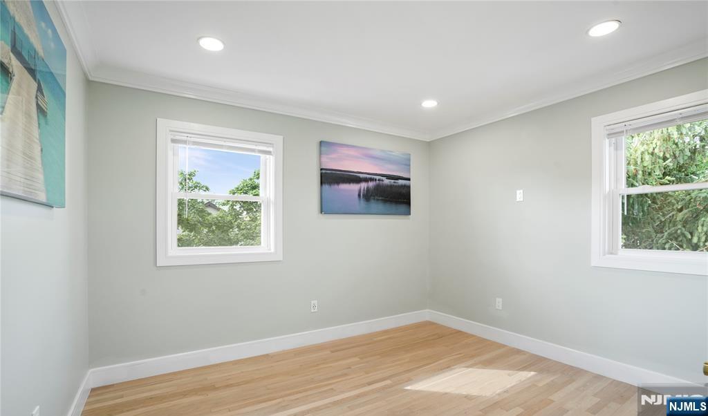 243 Hayward Place Wallington, NJ 07057 - Photo 7 of 9 an empty room with windows