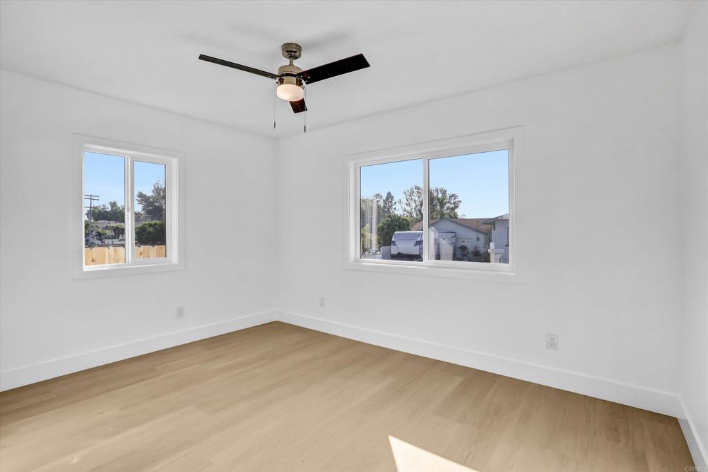 323 South 65th Street Encanto, CA 92114 - Photo 27 of 44 a view of a big room with wooden floor and windows