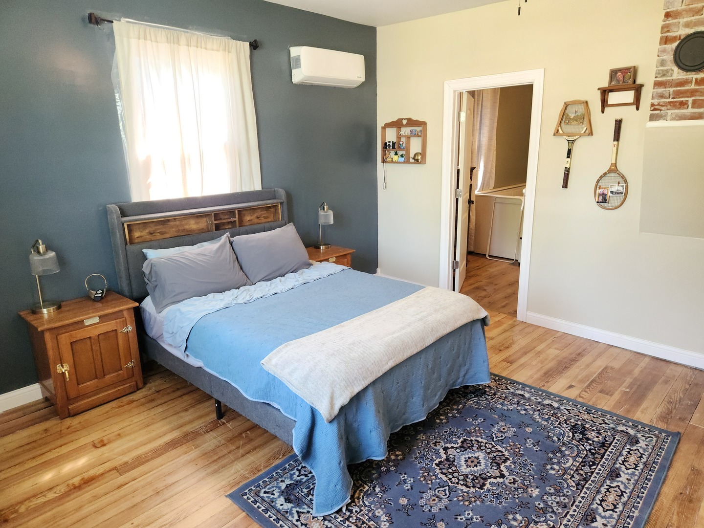701 South 20th Street Murphysboro, IL 62966 - Photo 18 of 32 a bedroom with a bed and wooden floor