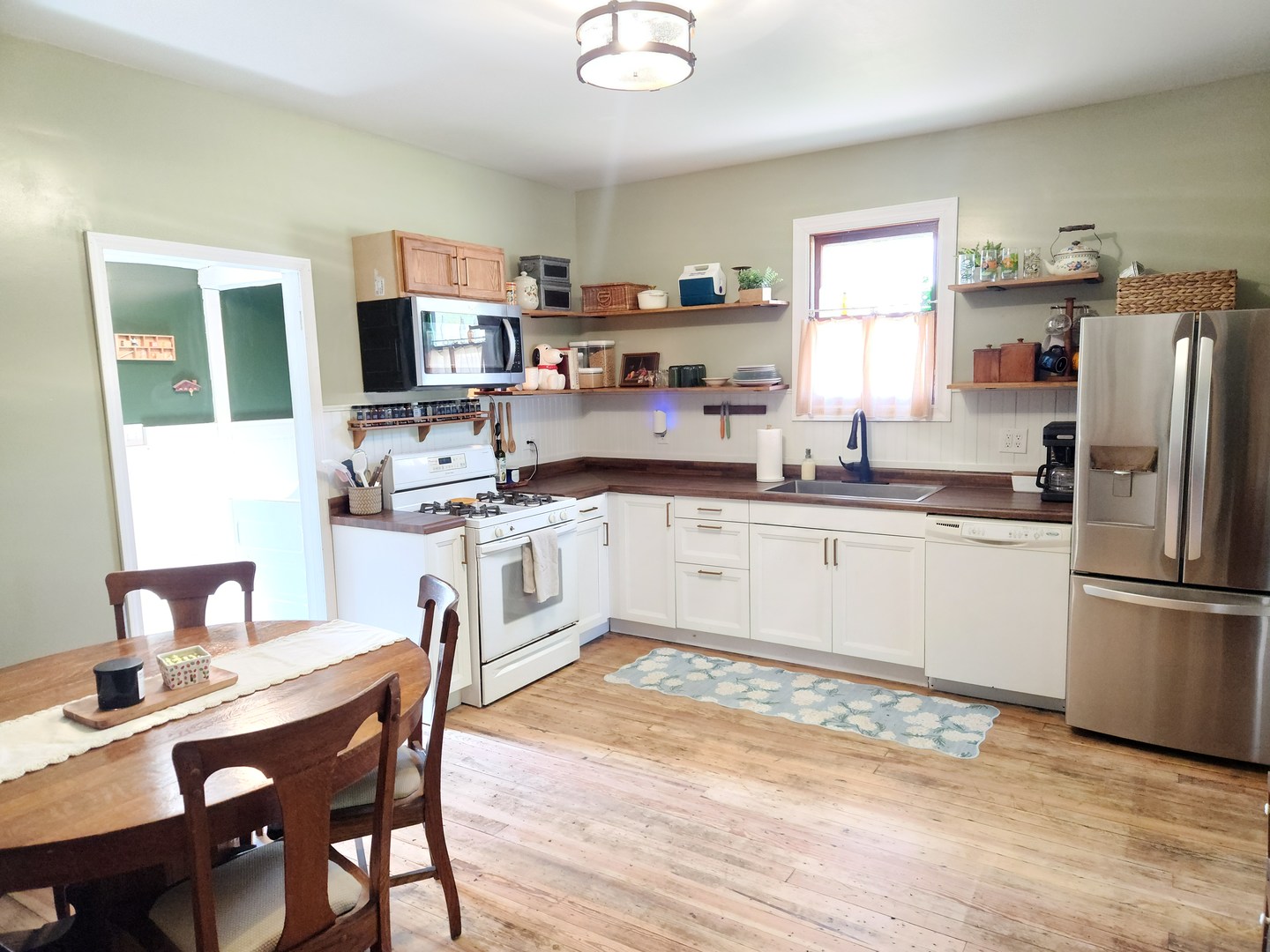 701 South 20th Street Murphysboro, IL 62966 - Photo 7 of 32 a kitchen with a sink stainless steel appliances and dining table