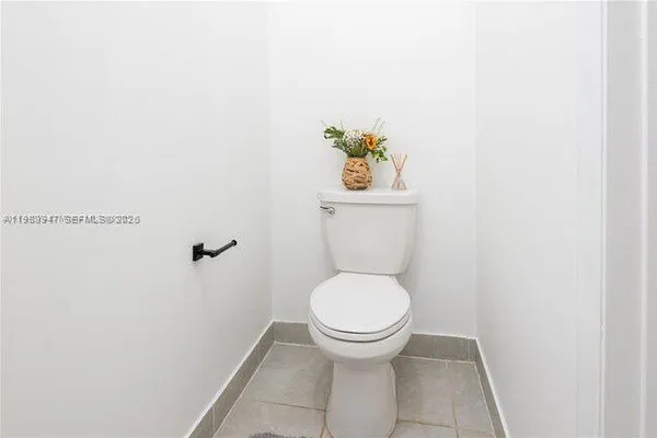 a bathroom with a toilet and a sink