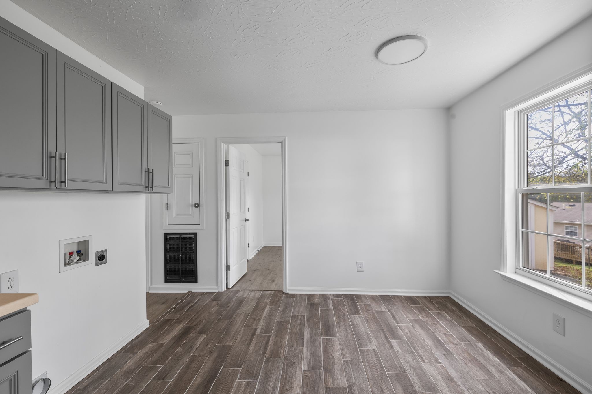 104 East Merchant Street Mount Pleasant, TN 38474 - Photo 17 of 30 a view of empty room with wooden floor and fan