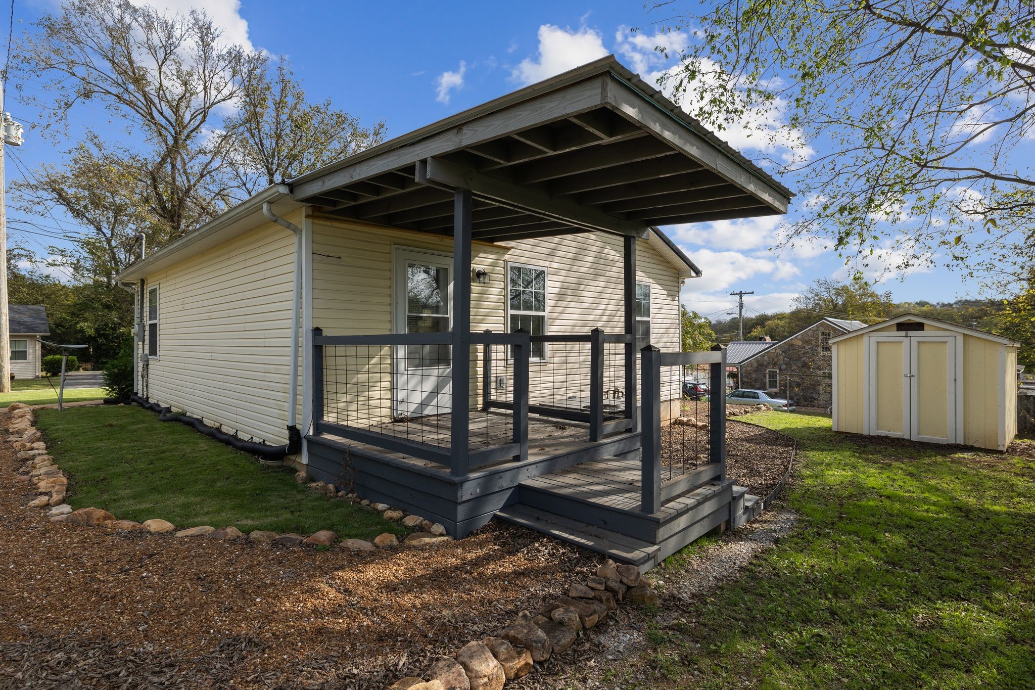 104 East Merchant Street Mount Pleasant, TN 38474 - Photo 20 of 30 a view of a backyard with a grill