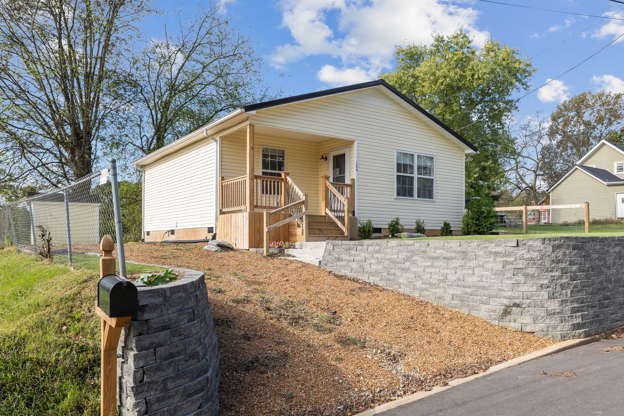 104 East Merchant Street Mount Pleasant, TN 38474 - Photo 2 of 30 a front view of a house with garden