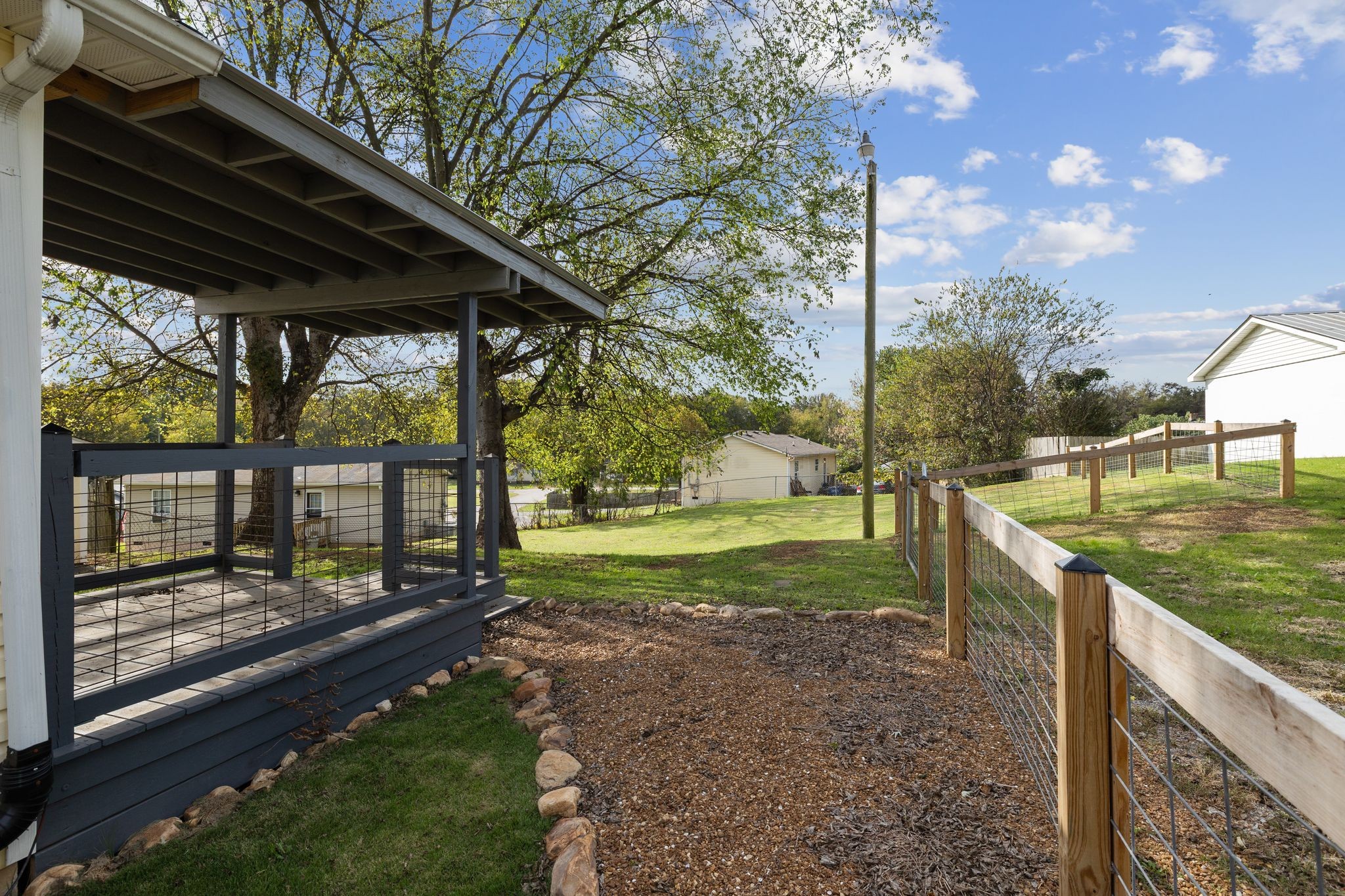 104 East Merchant Street Mount Pleasant, TN 38474 - Photo 21 of 30 a view of a porch with a backyard