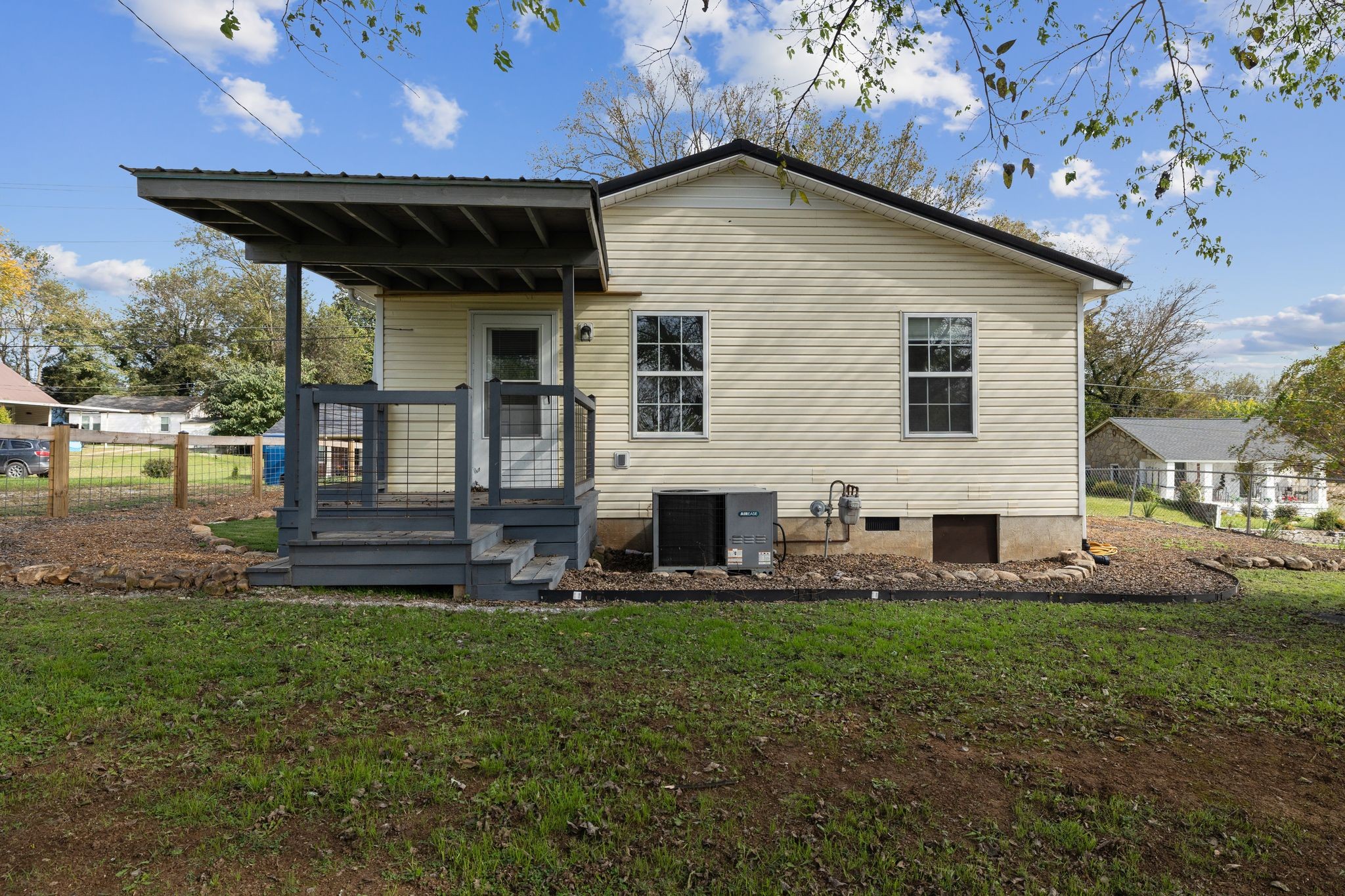 104 East Merchant Street Mount Pleasant, TN 38474 - Photo 23 of 30 a front view of a house with garden