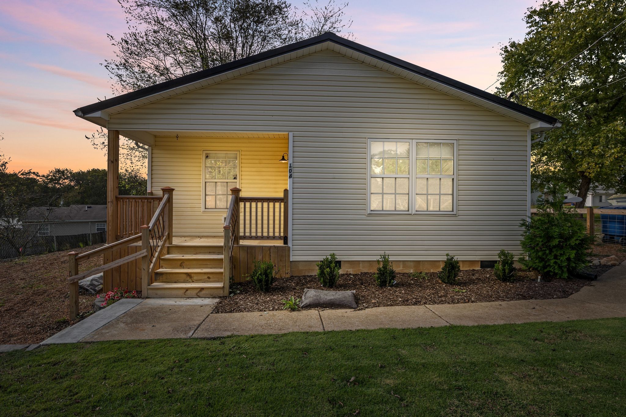 104 East Merchant Street Mount Pleasant, TN 38474 - Photo 26 of 30 a front view of a house with garden